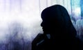 Side View of a Sadness Woman. Hand on Chin, Silhouette and Double Exposure style, Mixed by blurred light Bokeh and Dry Tree Royalty Free Stock Photo