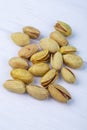 side view of salted roasted pistachios on white background Royalty Free Stock Photo