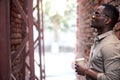 Side view on serious african man with cup of coffee Royalty Free Stock Photo