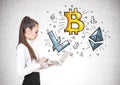 Calm woman with a laptop, cryptocurrency bitcoin