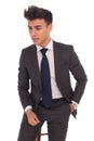 Side view of a serious young business man sitting on a chair Royalty Free Stock Photo
