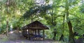 Side view of a shed ready for dining with plastic roof and without walls and the path of access, inside a typical Atlantic forest