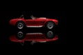 Side view of Shelby Cobra 427 Toy model car on a black background Royalty Free Stock Photo