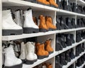 Side view of the shelves of a shoe store with many sales of women`s shoes. Business concept