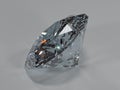 Side view of a shining diamond on a gray background Royalty Free Stock Photo