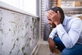 Shocked Man Looking At Mold On Wall Royalty Free Stock Photo