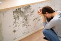 Shocked Woman Looking At Mold On Wall Royalty Free Stock Photo