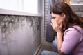 Shocked Woman Looking At Mold On Wall Royalty Free Stock Photo