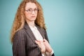 Side view shot of freezing bossy teacher wearing glasses with suit jacket