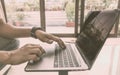 Side view shot of hands of a busy business man working in notebook laptop doing project on office desk. Businessman using computer Royalty Free Stock Photo