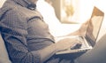 Side view shot of a man`s hands using smart phone in interior, rear view of business man hands busy using cell phone at office de Royalty Free Stock Photo