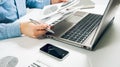 Side view shot of a man`s hands using smart phone in interior, rear view of business man hands busy using cell phone at office de Royalty Free Stock Photo