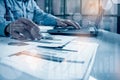 Side view shot of a man`s hands using smart phone in interior, rear view of business man hands busy using cell phone at Royalty Free Stock Photo