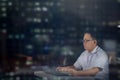 Focused working man at night. Night shift. Royalty Free Stock Photo