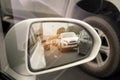 Side view side mirror white car running on the road. Royalty Free Stock Photo