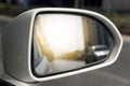 Side view side mirror white car running on the road. Royalty Free Stock Photo