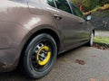 Side view of Skoda Octavia brown car with spare tire wheel Nexen N'Blue HD