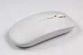 Side view of a sleek white wireless computer mouse Royalty Free Stock Photo