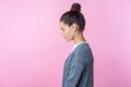 Side View Of Sleepy Brunette Teenage Girl Standing Dreaming Or Imagining With Closed Eyes.  On Pink Background
