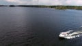 Side view of small powerboat riding in big lake, aerial view from drone, copyspace Royalty Free Stock Photo