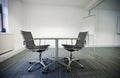 Side view of small table and two chairs in office