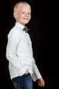 Side view of smiling boy wearing white shirt Royalty Free Stock Photo