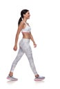 Side view of smiling fitness woman walking Royalty Free Stock Photo