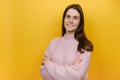 Side view smiling happy cheerful young caucasian woman wearing pink knitted sweater hold hands crossed folded Royalty Free Stock Photo