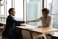 Side view smiling hr manager shaking African American woman hand Royalty Free Stock Photo