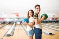 Teenage Couple With Balls Standing In Bowling Club Royalty Free Stock Photo