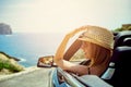 Side view on smiling woman in convertible car Royalty Free Stock Photo