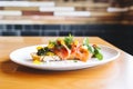 side view of smoked salmon bruschetta on a white plate Royalty Free Stock Photo