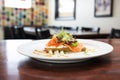 side view of smoked salmon bruschetta on a white plate Royalty Free Stock Photo