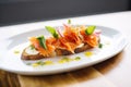 side view of smoked salmon bruschetta on a white plate Royalty Free Stock Photo