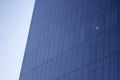 Side view of a smooth blue glass window wall of an office building. Royalty Free Stock Photo