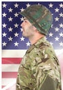 Side view of soldier in front of american flag