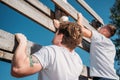 side view of soldiers climbing wooden barrier during obstacle run Royalty Free Stock Photo