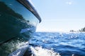 Side view Speeding fishing motor boat with drops of water. Blue ocean sea water wave reflections with fast fishing yacht. Motor bo Royalty Free Stock Photo