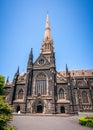 Side view of St Patrick`s Cathedral and spire a Roman Catholic Cathedral church in Melbourne Vic Australia Royalty Free Stock Photo