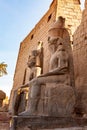 Side view statue of Pharaoh Ramses II at the entrance to the famous Luxor Temple complex