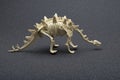Side view stegosaurus skeleton on dark background