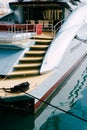 Side view of a stern trawl of beautiful motor white yacht moored to the pier Royalty Free Stock Photo