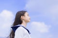 Side view of student girl enjoying summer breeze , smiling with eyes closed Royalty Free Stock Photo