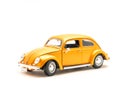 Side view studio shot small orange toy car isolated on white Royalty Free Stock Photo