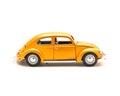 Side view studio shot small orange toy car isolated on white Royalty Free Stock Photo