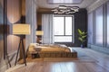 Side view on stylish bedroom with foggy city view from big window, modern chandelier, dark decorated walls and comfortable floor Royalty Free Stock Photo