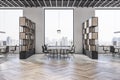 Side view on stylish work places in spacious modern office with eco style interior design, wooden shelves and city view from big Royalty Free Stock Photo