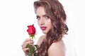 Side view. stylish young woman with red rose .