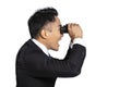 Side view of Surprised Young businessman looking through binoculars