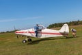 The side view of the tail, body, wings, nose and propeller of Piper PA-25 Pawnee tow aircraft